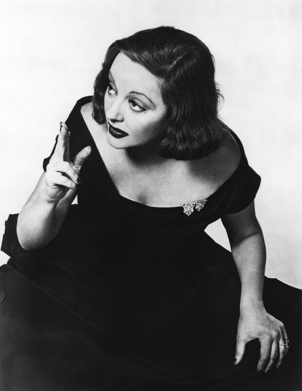 woman in black dress posing