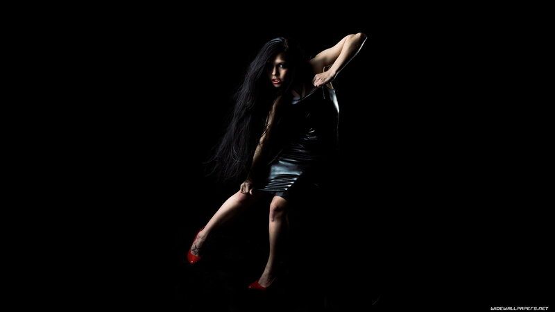 woman in black dress posing