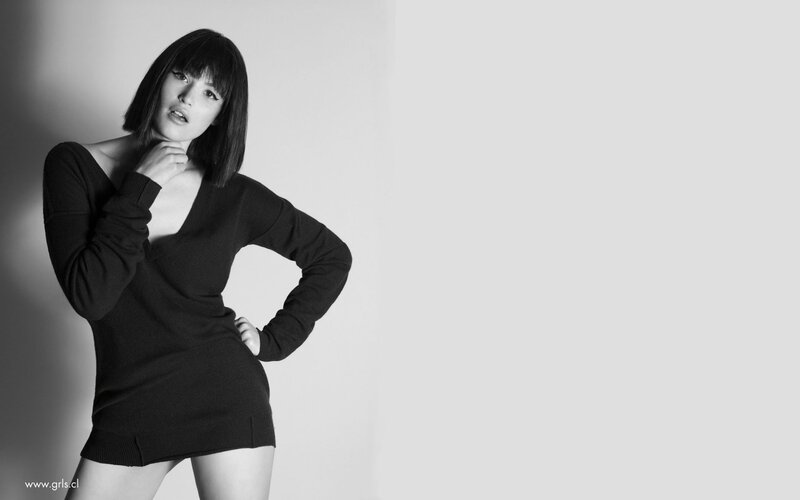 woman in black dress posing