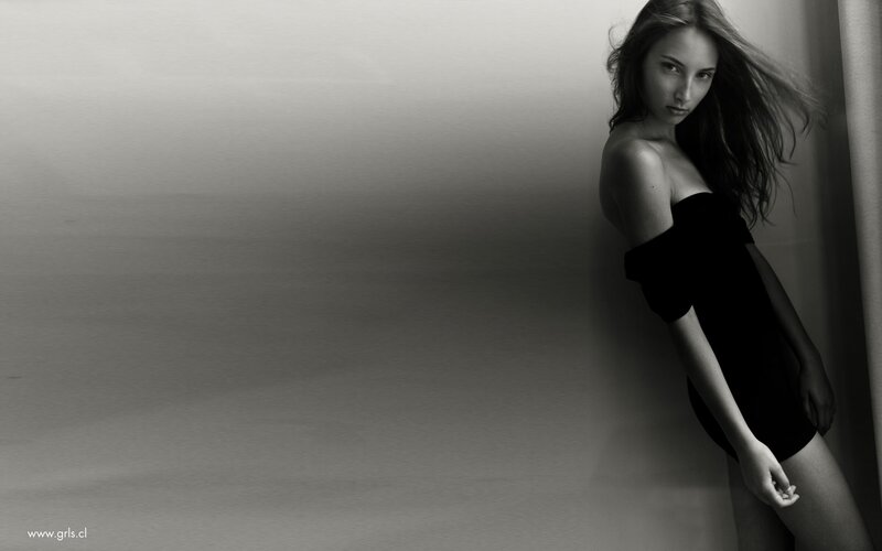 woman in black dress posing