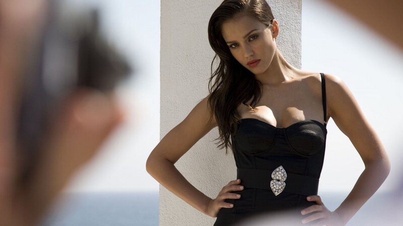 woman in black dress posing