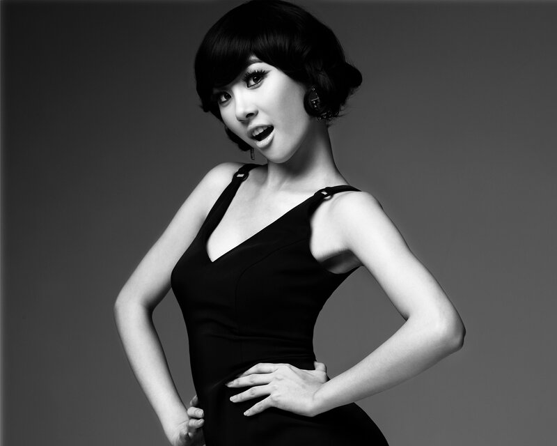 woman in black dress posing