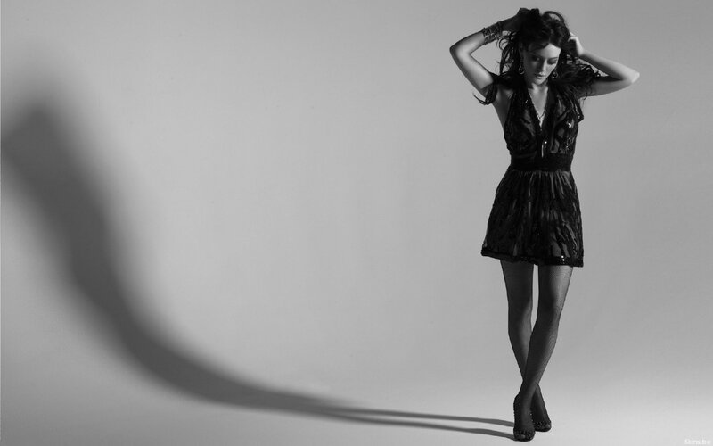 woman in black dress posing