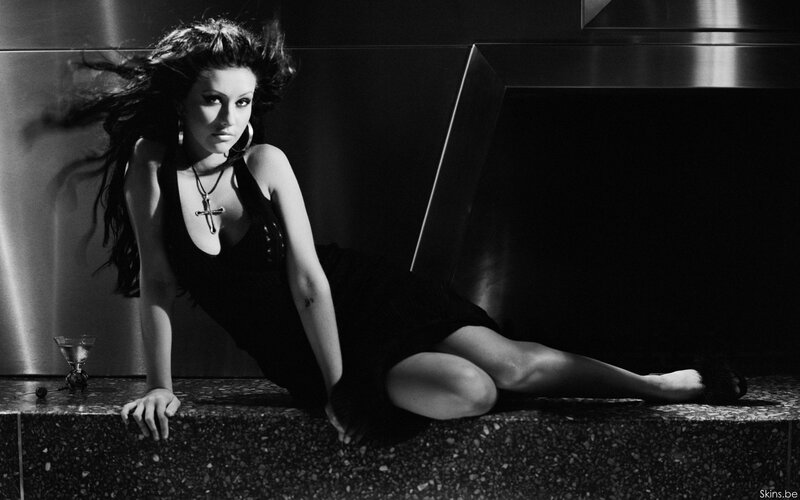 woman in black dress posing
