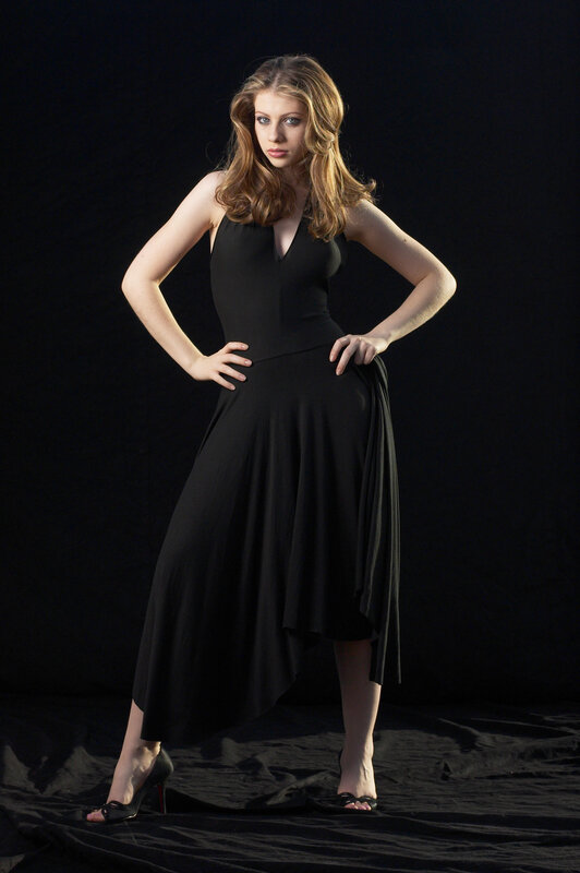 woman in black dress posing