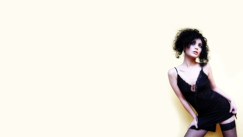 woman in black dress posing
