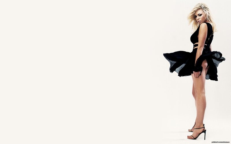 woman in black dress posing
