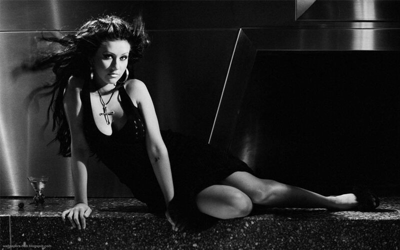 woman in black dress posing