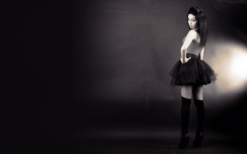 woman in black dress posing