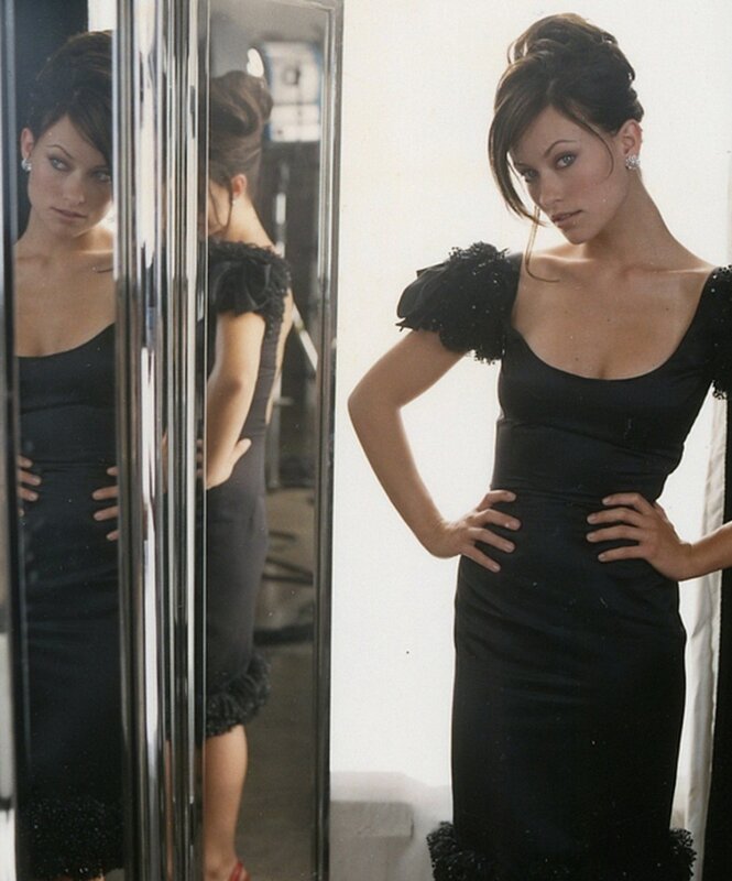 woman in black dress posing
