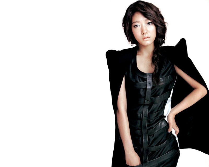 woman in black dress posing