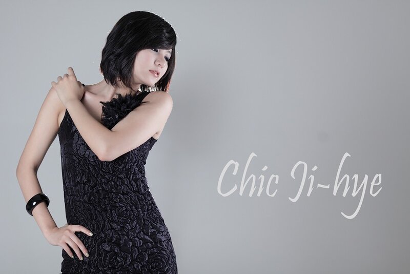 woman in black dress posing