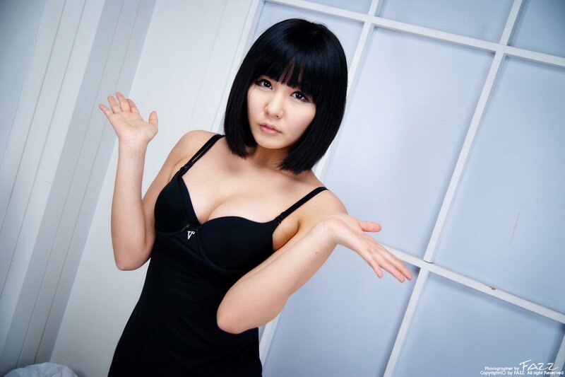 woman in black dress posing