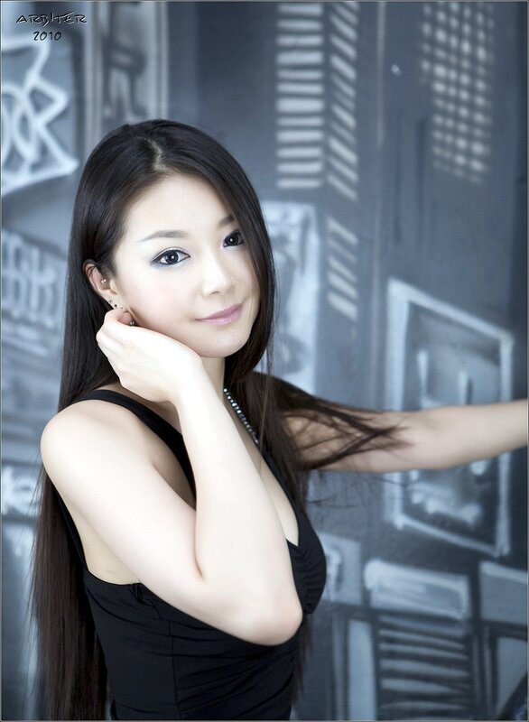 woman in black dress posing