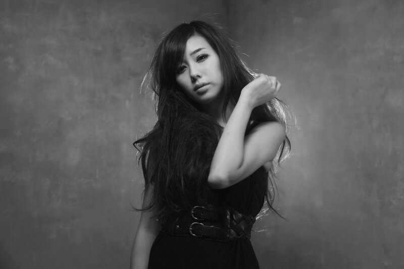 woman in black dress posing