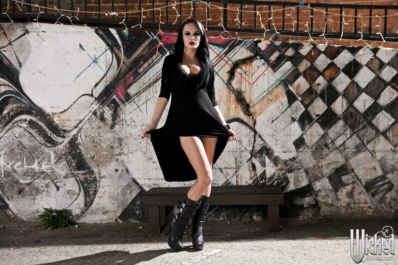 woman in black dress posing