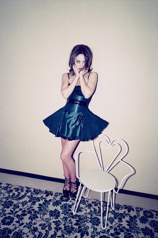 woman in black dress posing