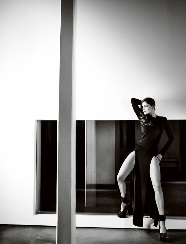 woman in black dress posing