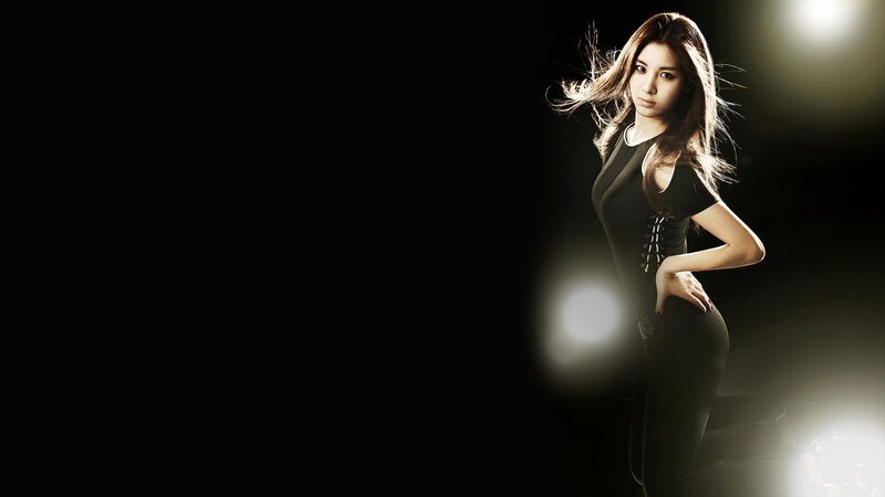 woman in black dress posing
