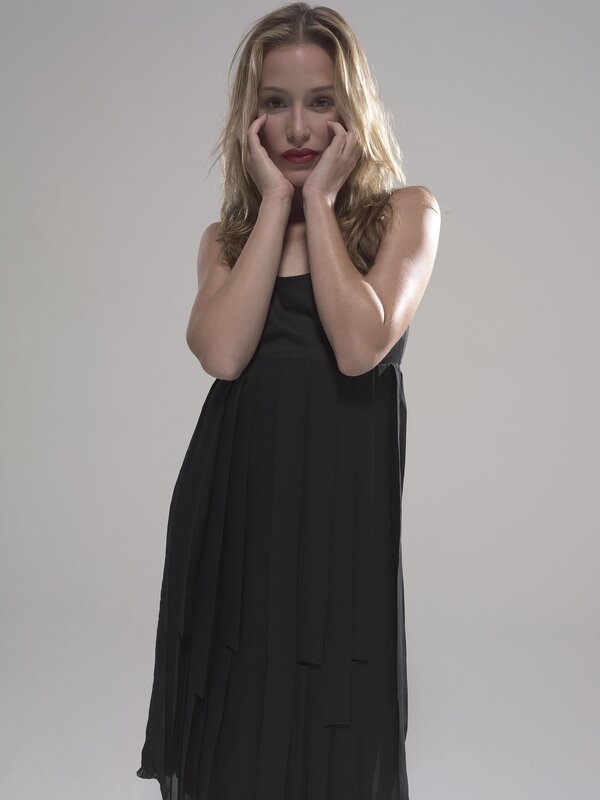 woman in black dress posing
