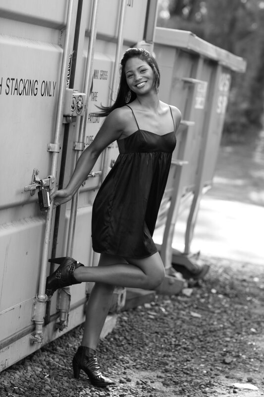 woman in black dress posing