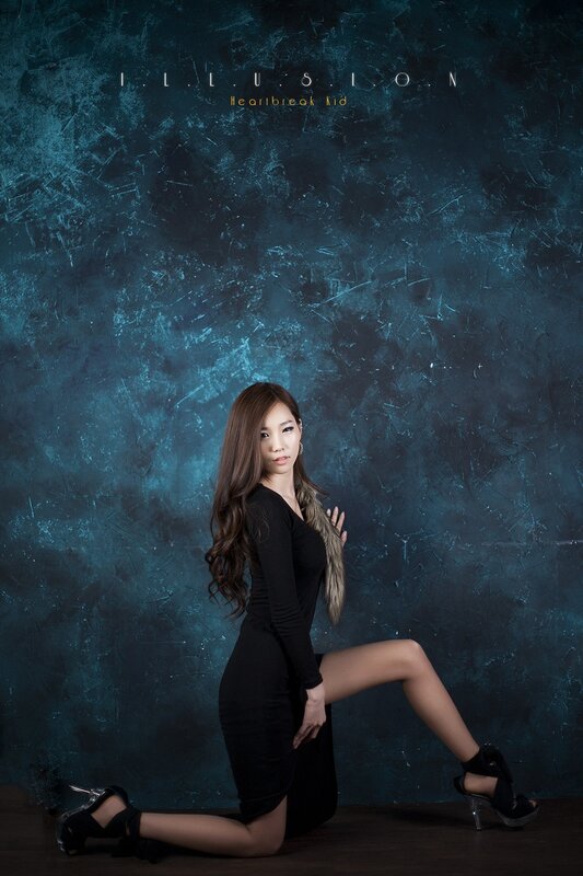 woman in black dress posing