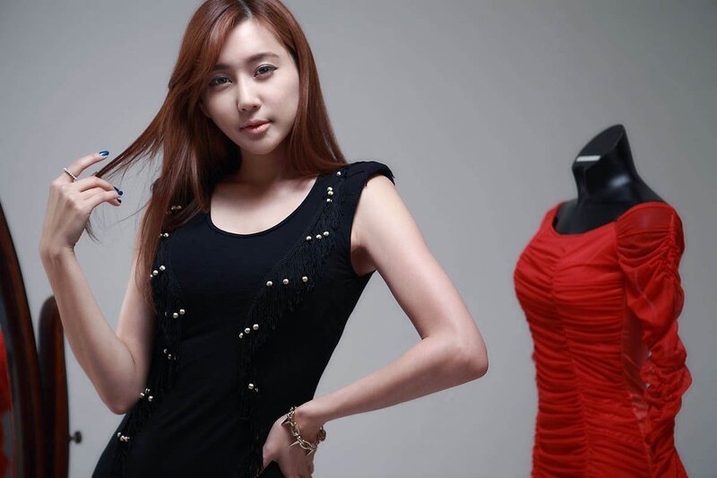 woman in black dress posing
