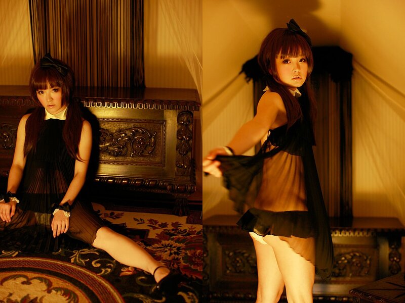 woman in black dress posing