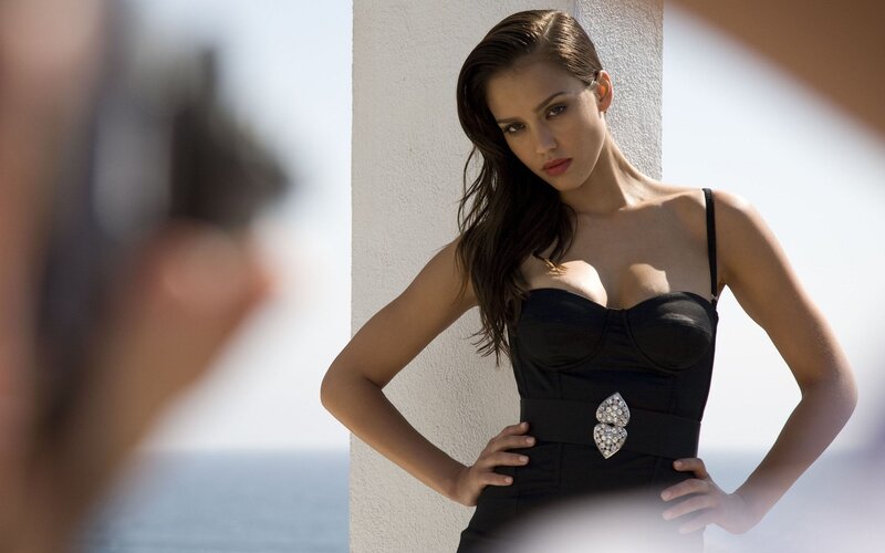 woman in black dress posing
