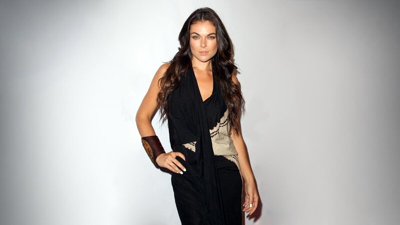 woman in black dress posing