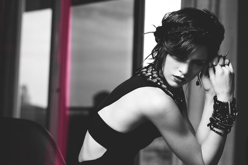 woman in black dress posing