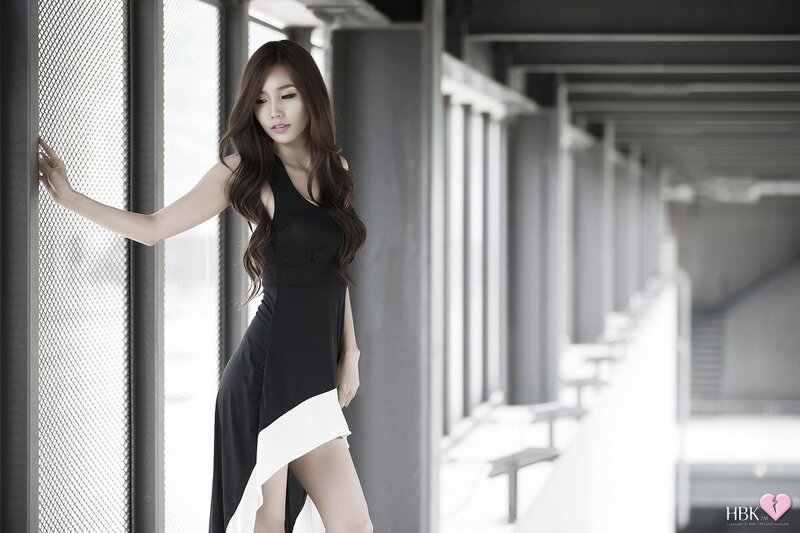 woman in black dress posing