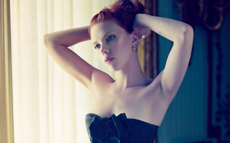 woman in black dress posing