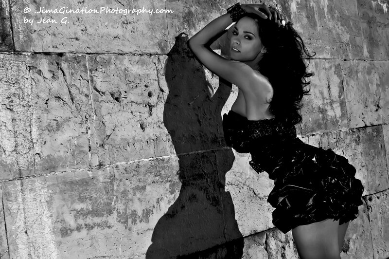 woman in black dress posing
