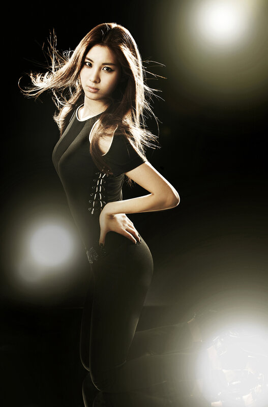 woman in black dress posing