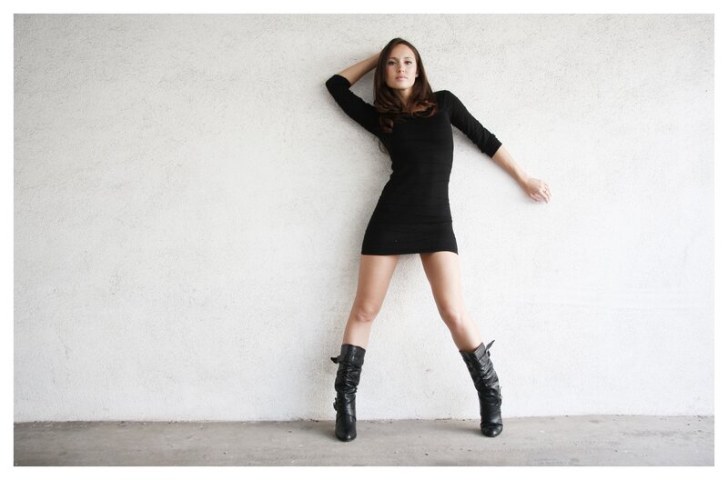woman in black dress posing