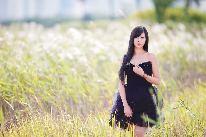 Woman in Black Dress — Serene, Afternoon, Photograph, Field