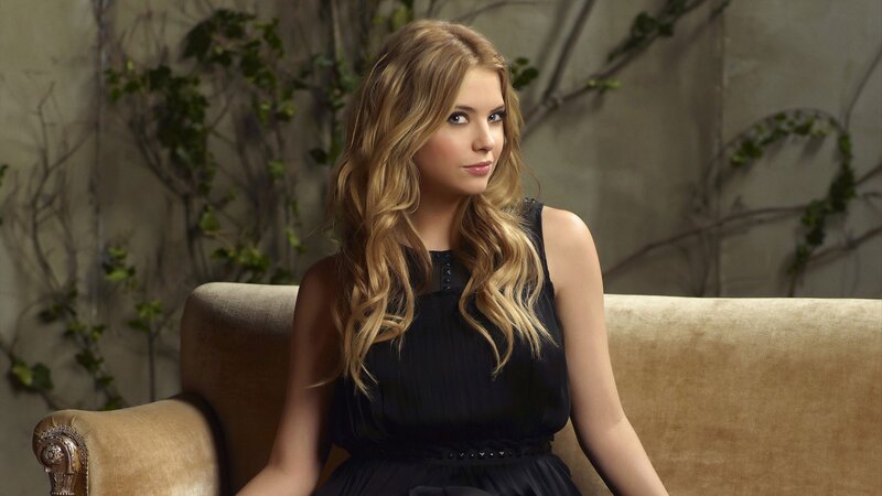 woman in black dress sitting