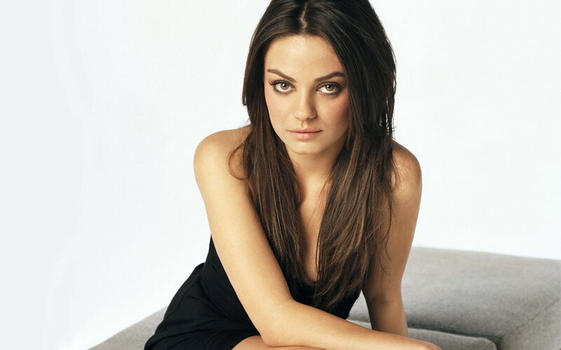 woman in black dress sitting