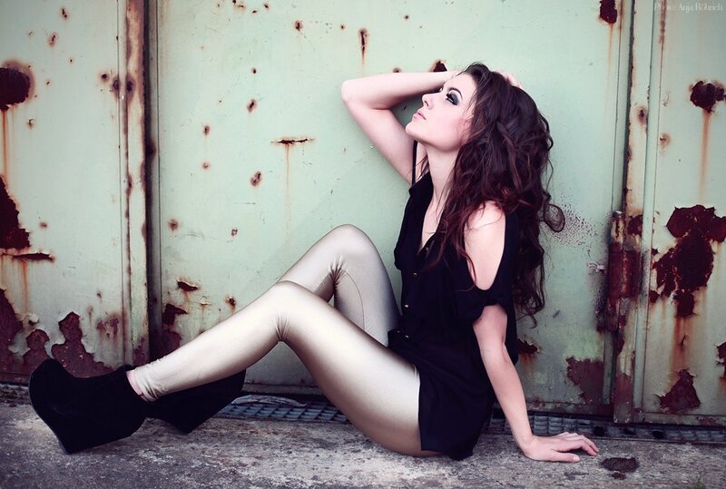 woman in black dress sitting