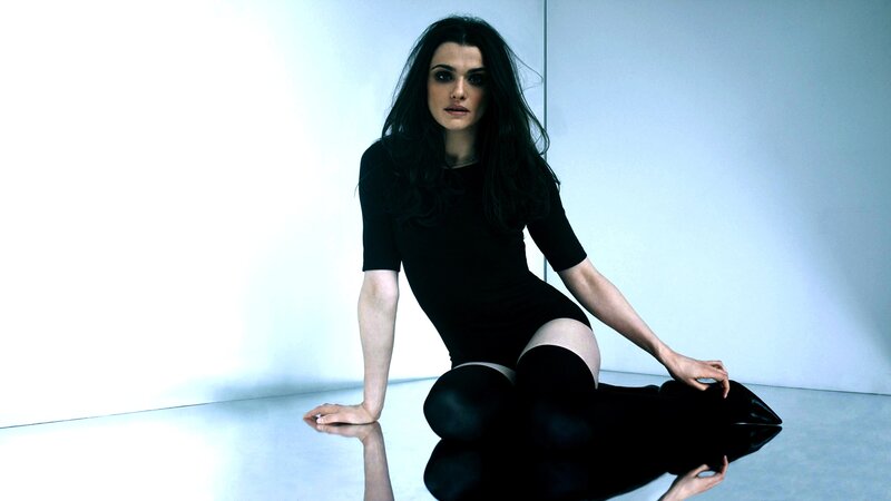 woman in black dress sitting