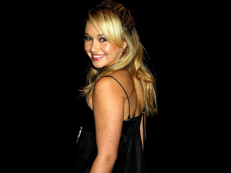 woman in black dress smiling