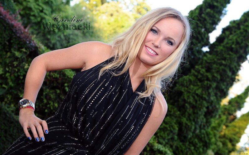 woman in black dress smiling