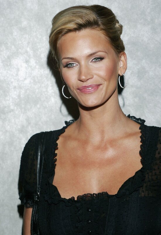 woman in black dress smiling