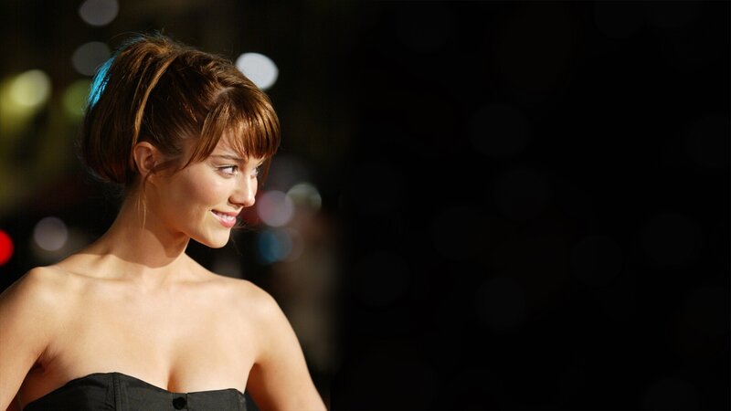woman in black dress smiling
