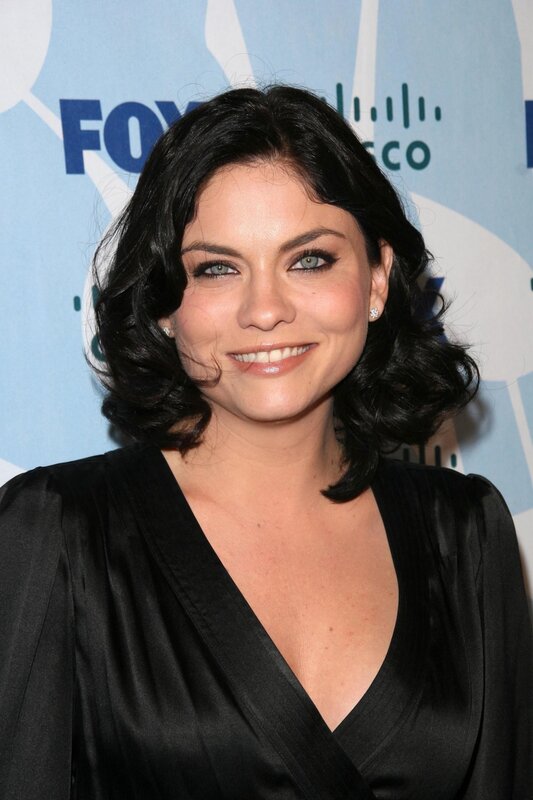 woman in black dress smiling