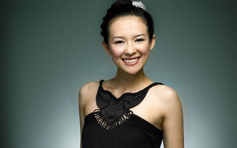 woman in black dress smiling