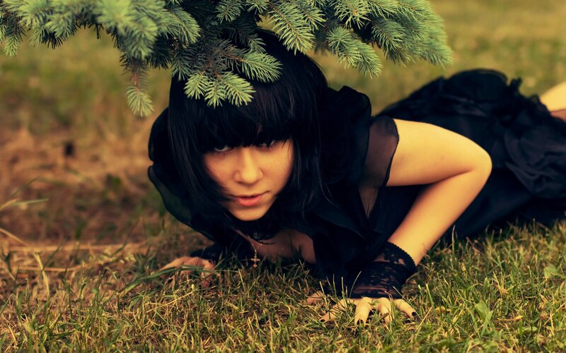 woman in black dress under tree