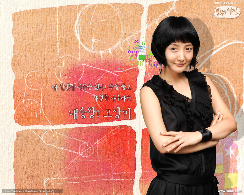 woman in black dress with arms crossed