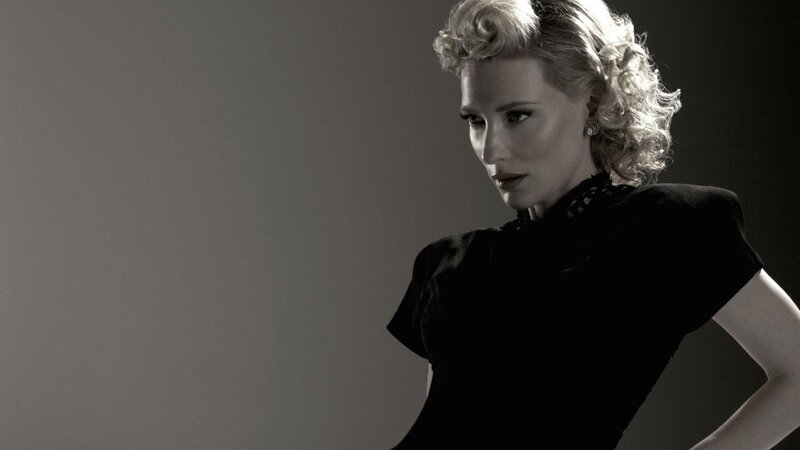 woman in black dress with blonde hair